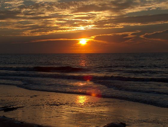 Sunset over the surf on a St. Simons beach